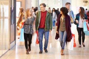 33469480 - group of young friends shopping in mall together