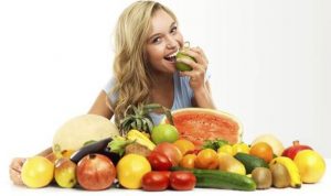 woman-eating-vegetables-and-fruit-553148